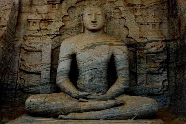 photograph of a meditating buddha statue